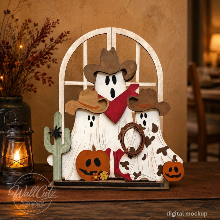 Ghost Town Posse Halloween wood window kit with painted cowboy ghosts, cactus, and pumpkins on a lantern-lit table – WallCutz