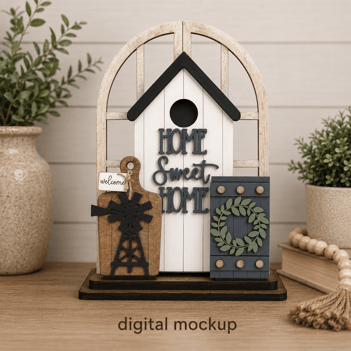 Farmhouse scene with windmill, cutting board, birdhouse, and wreath assembled in the WallCutz interchangeable window kit
