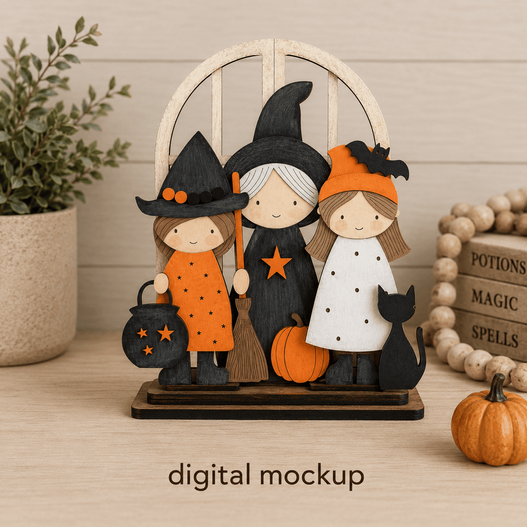 Three Halloween witches and a black cat assembled in the WallCutz interchangeable window kit