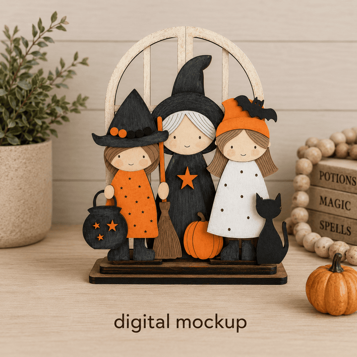 Three Halloween witches and a black cat assembled in the WallCutz interchangeable window kit