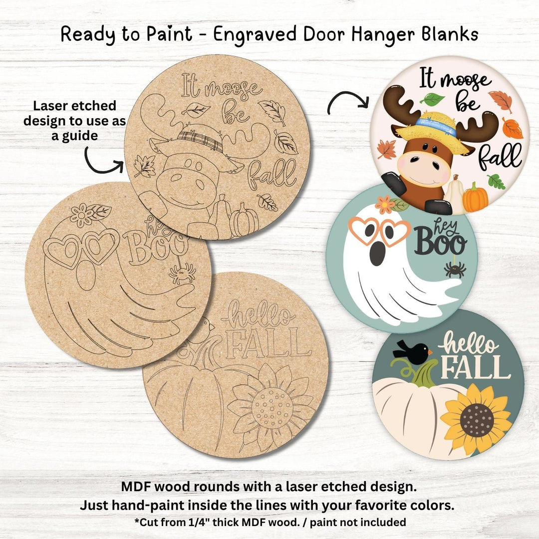 Close-up of paint-in-the-lines engraved designs on MDF door hanger blanks